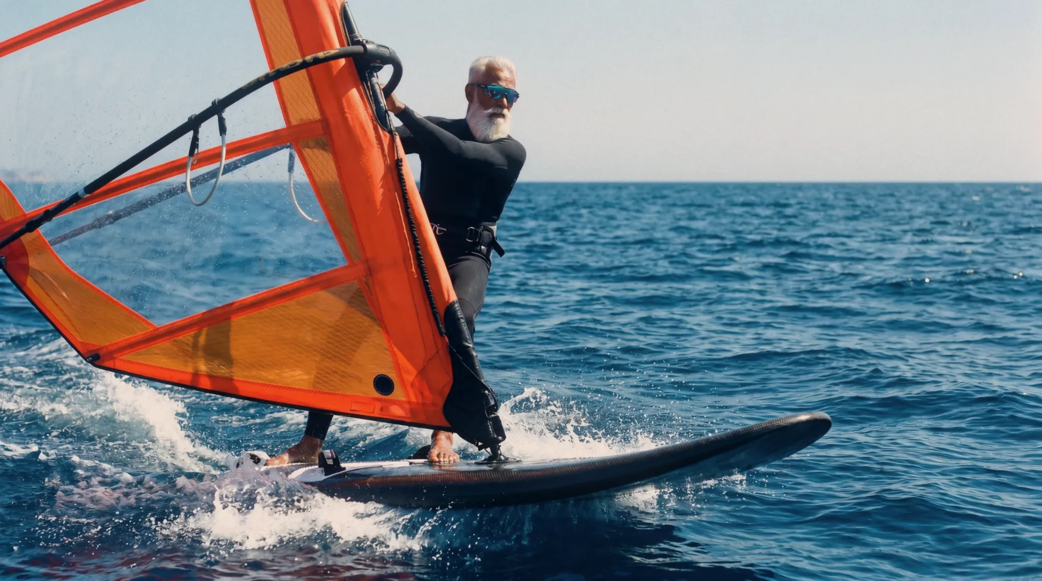 Windsurfer in Oakley sunglasses at speed
